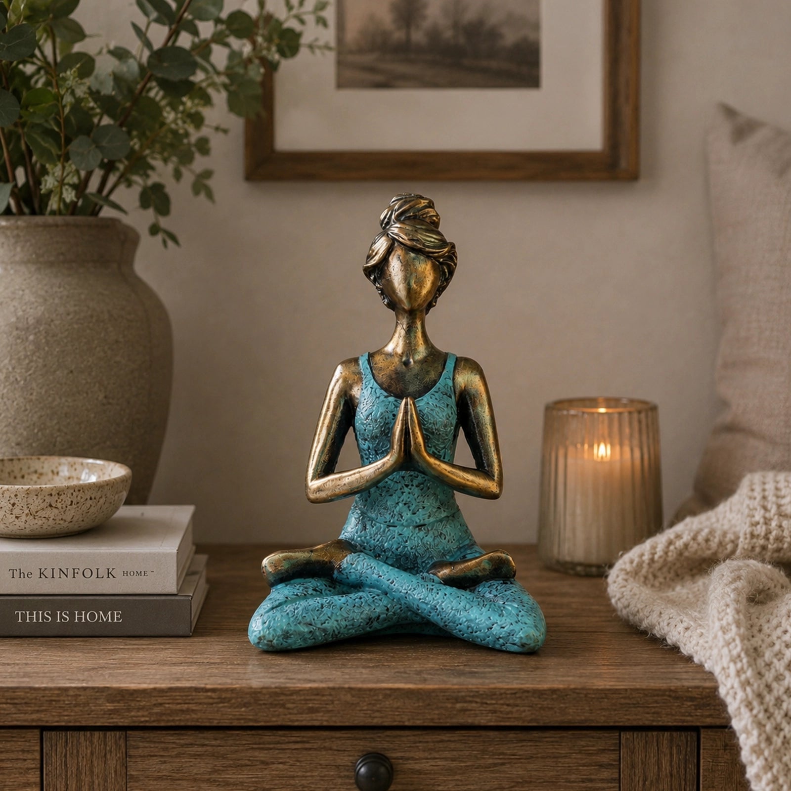 Yoga Lady Figure - Bronze & Turquoise 24cm depicts a serene woman in a seated yoga pose with hands in prayer, featuring a bronze finish and turquoise outfit.