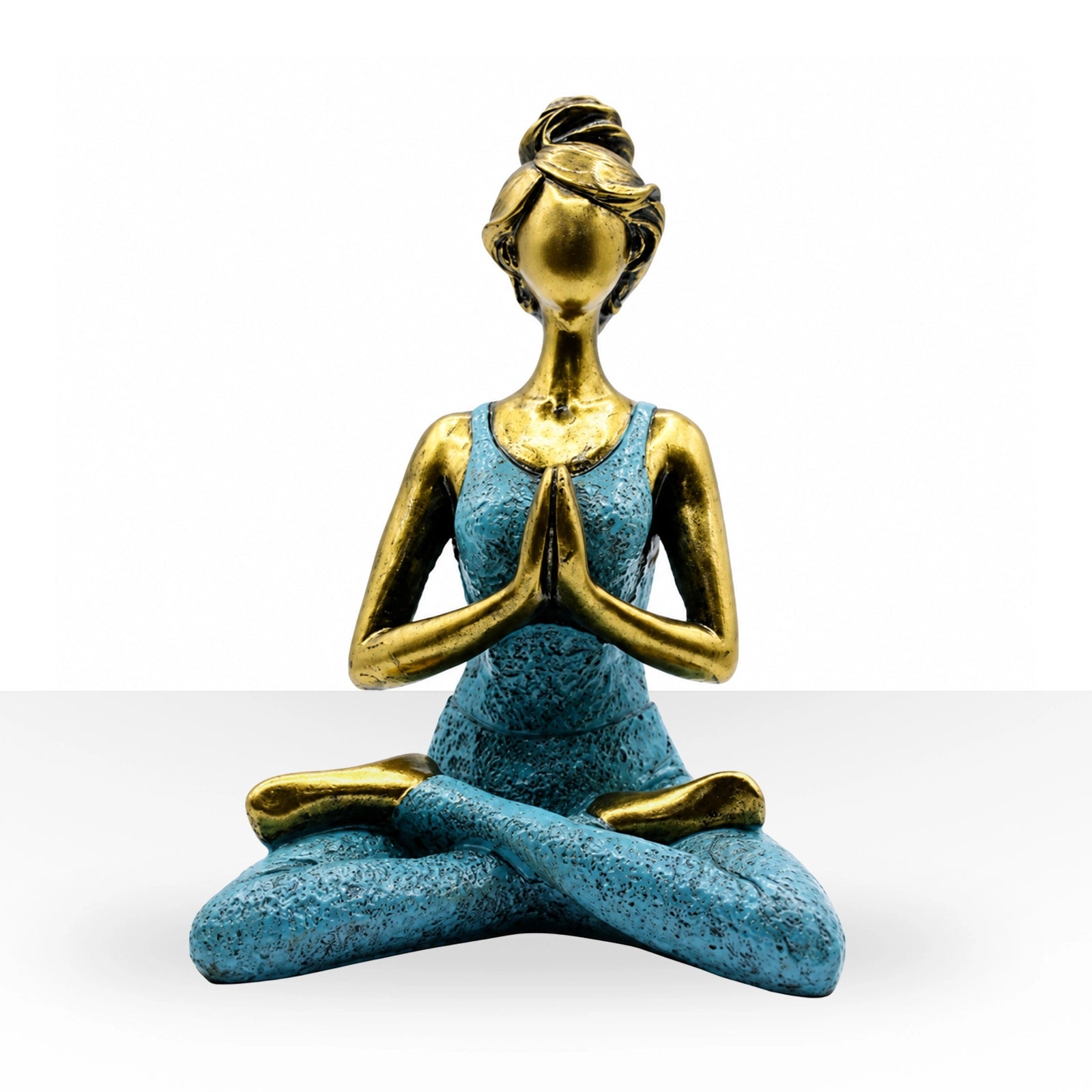 Yoga Lady Figure - Bronze & Turquoise 24cm depicts a serene woman in a seated yoga pose with hands in prayer, featuring a bronze finish and turquoise outfit.