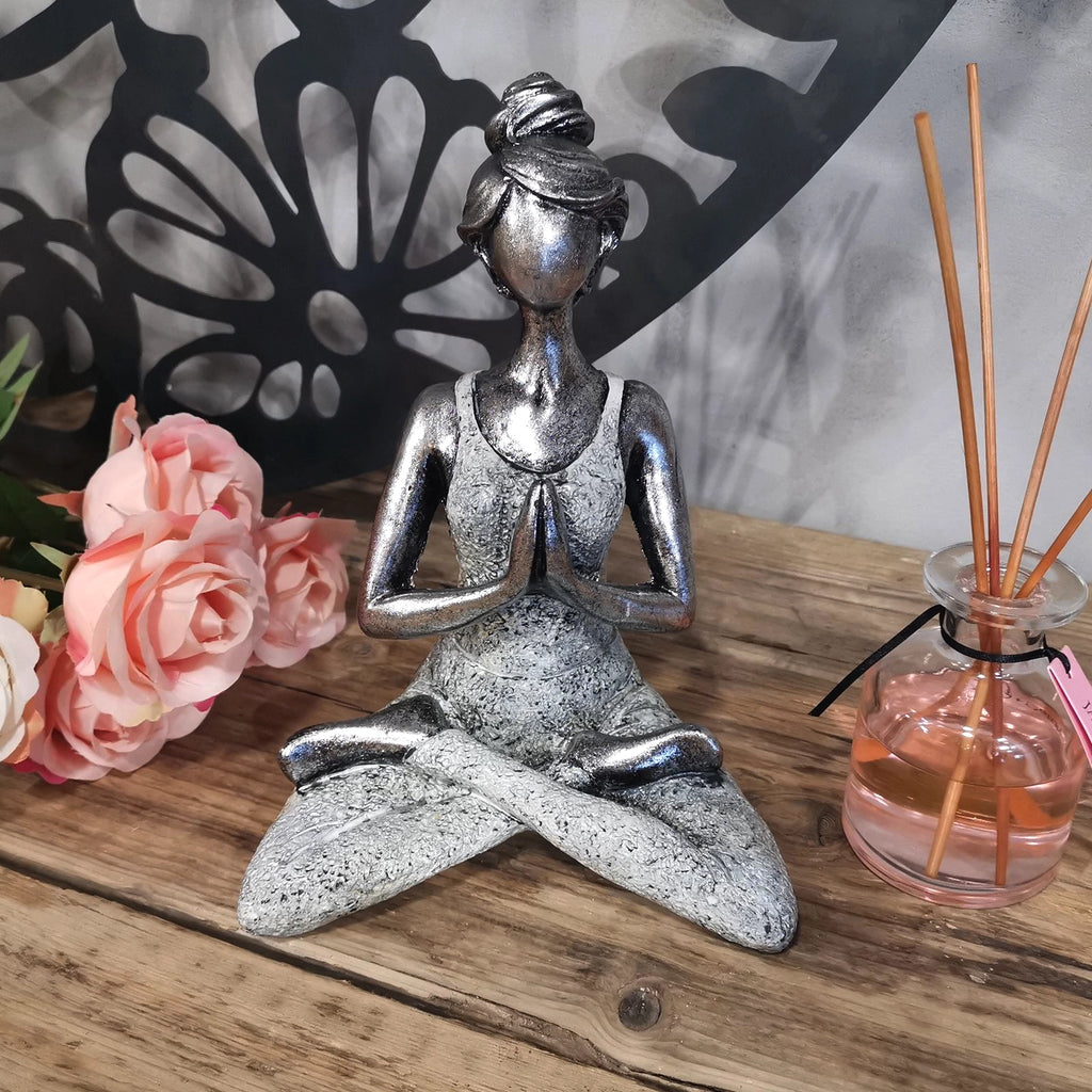 Yoga Lady Figure - Silver & White 24cm showing a serene woman in a cross-legged meditation pose with hands in prayer, crafted in silver and white tones.