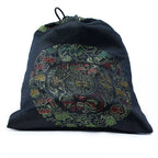 Black drawstring bag with colorful dragon design on a white background