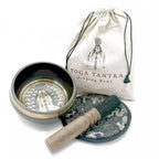 Yoga Tantra singing bowl set with bowl, cover, and mallet on a white background