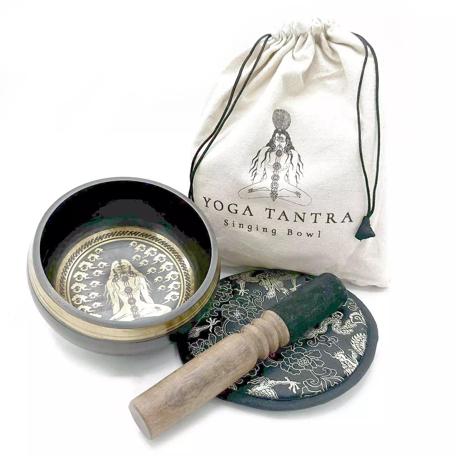 Yoga Tantra singing bowl set with bowl, cover, and mallet on a white background