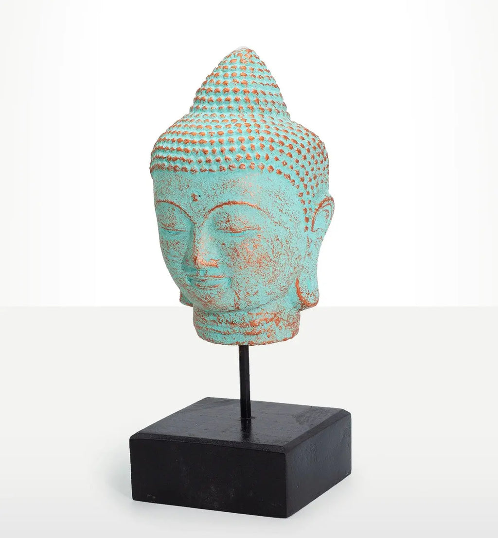 Stillness Buddha Head on Stand - Green Copper, a serene Buddha head sculpture with a green copper patina finish mounted on a black stand, ideal for Buddha decor and tabletop display.