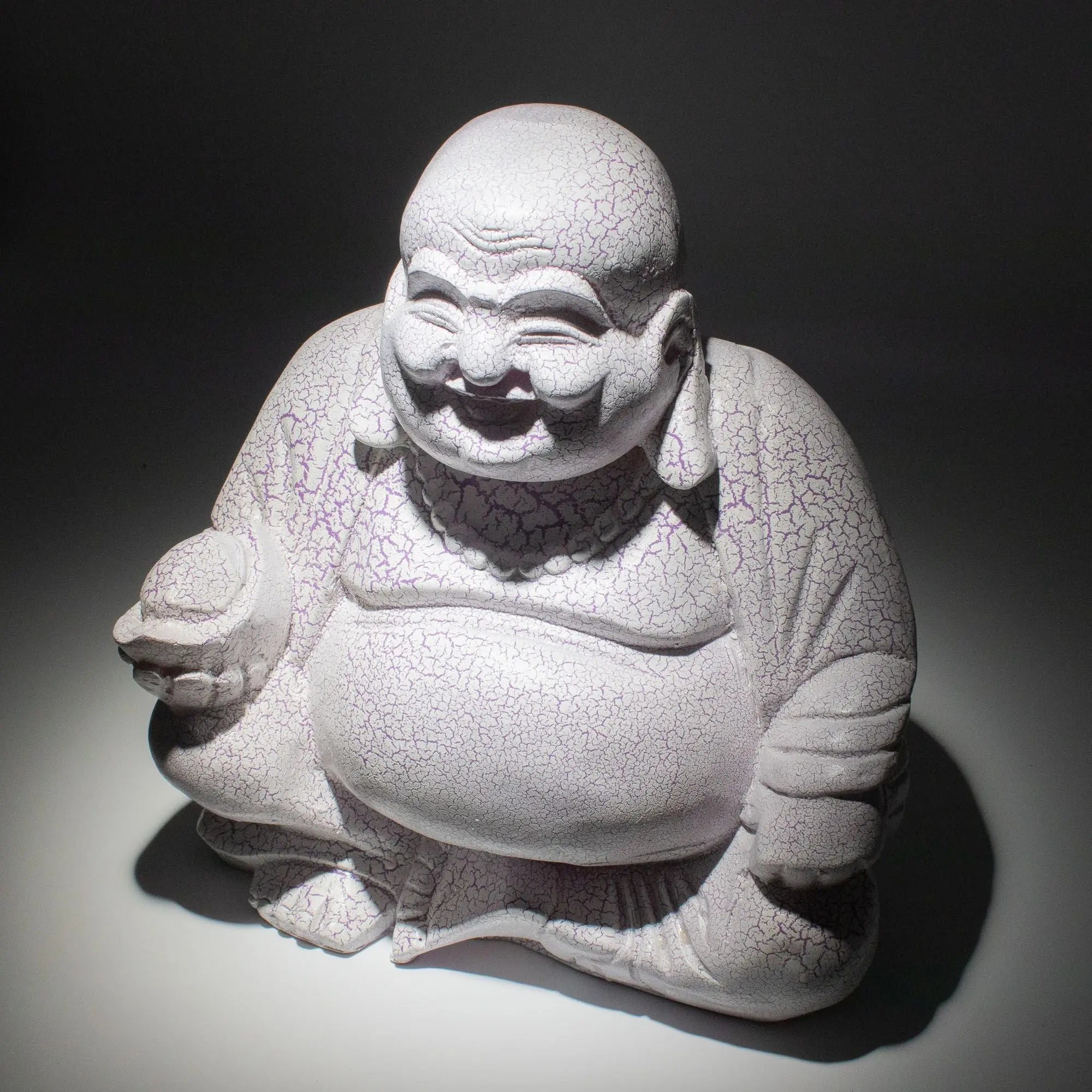 Laughing Buddha Lamp Lavender Crackle - Round Stand, hand-carved resin Buddha statue with a crackled lavender finish and joyful expression, sitting on a round stand.