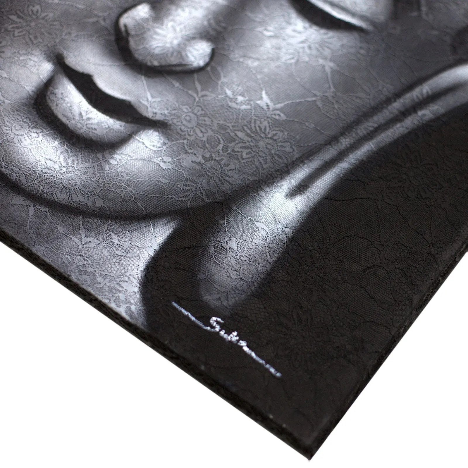 Close-up of a serene Buddha face embossed with intricate floral brocade patterns in grey tones, featured on the Buddha Painting - Grey Brocade Detail.