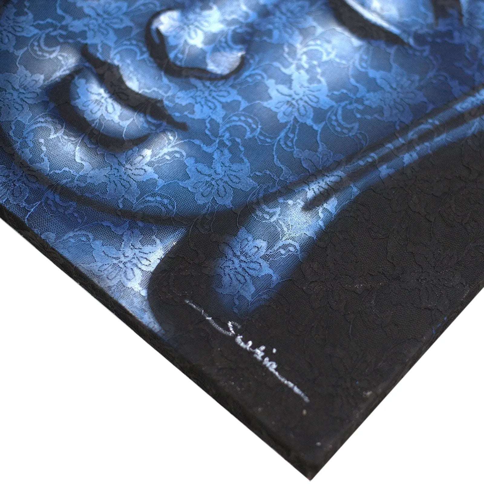 Close-up of a Buddah Painting - Blue Brocade Detail featuring intricate blue brocade floral patterns with subtle shadows highlighting textured Buddha imagery.