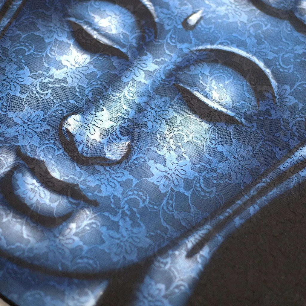 Close-up of a serene Buddha face with intricate blue brocade detail overlay, highlighting the peaceful expression in the Buddah Painting - Blue Brocade Detail.