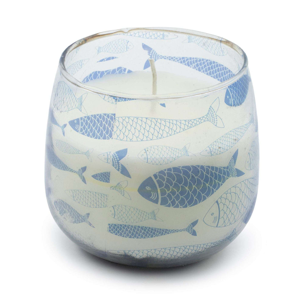 Medium Glass Jar Candles - Seabreeze featuring a clear glass container decorated with various blue fish illustrations, filled with white wax and a single wick.