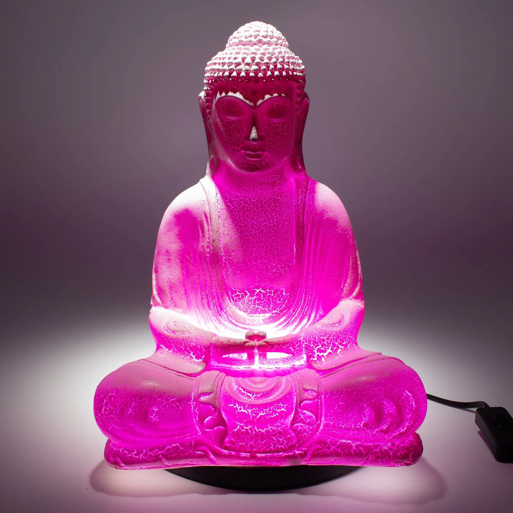 Meditation Buddha Lamp Cherry Crackle - Oval Stand glowing in vibrant pink light, featuring a crackled texture and seated Buddha figure illuminated on an oval base.