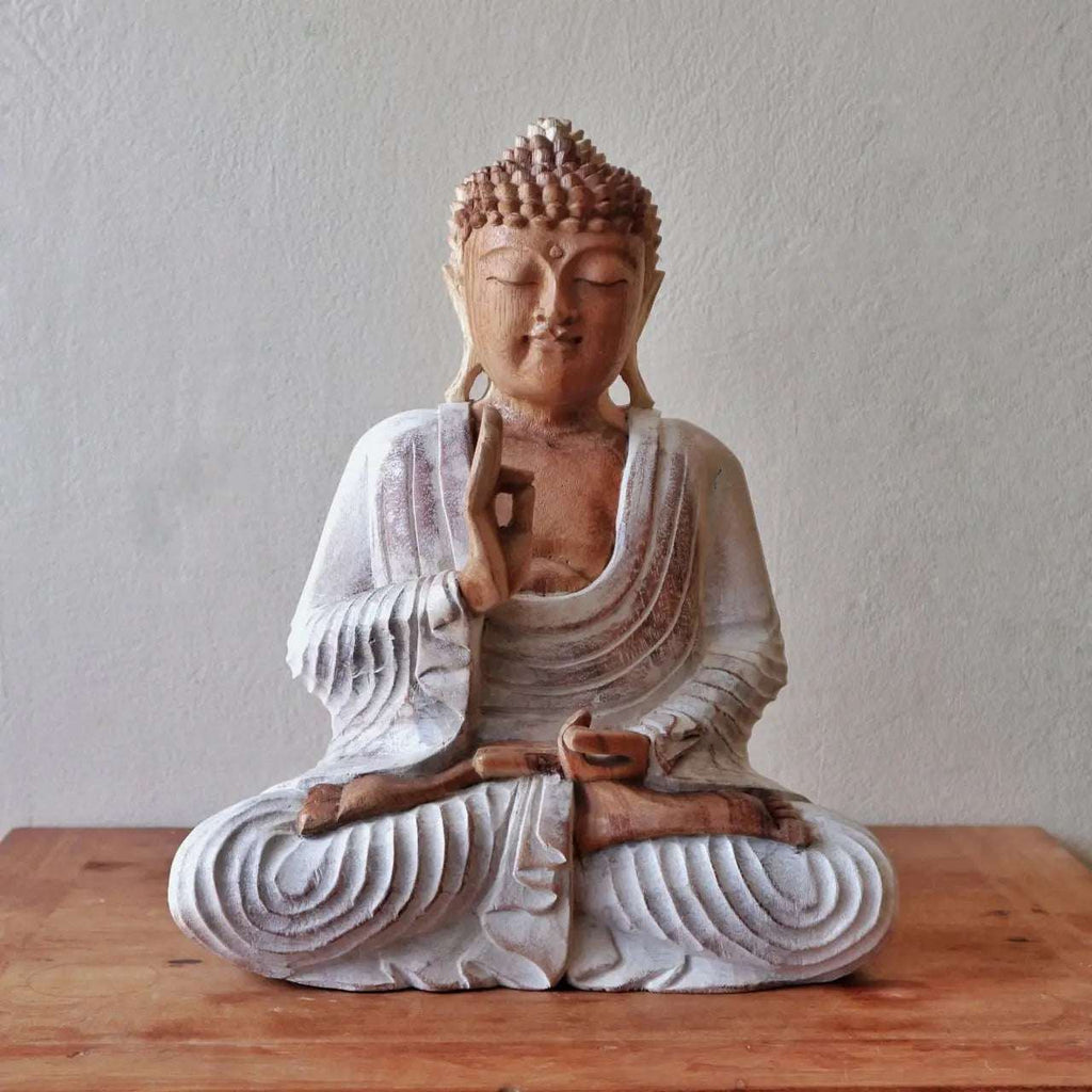 Buddha Statue Whitewash - 30cm Teaching Transmission showing a serene hand-carved Buddha figure in meditative pose with detailed whitewashed robes on a wooden surface.