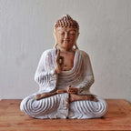 Buddha Statue Whitewash - 30cm Teaching Transmission showing a serene hand-carved Buddha figure in meditative pose with detailed whitewashed robes on a wooden surface.