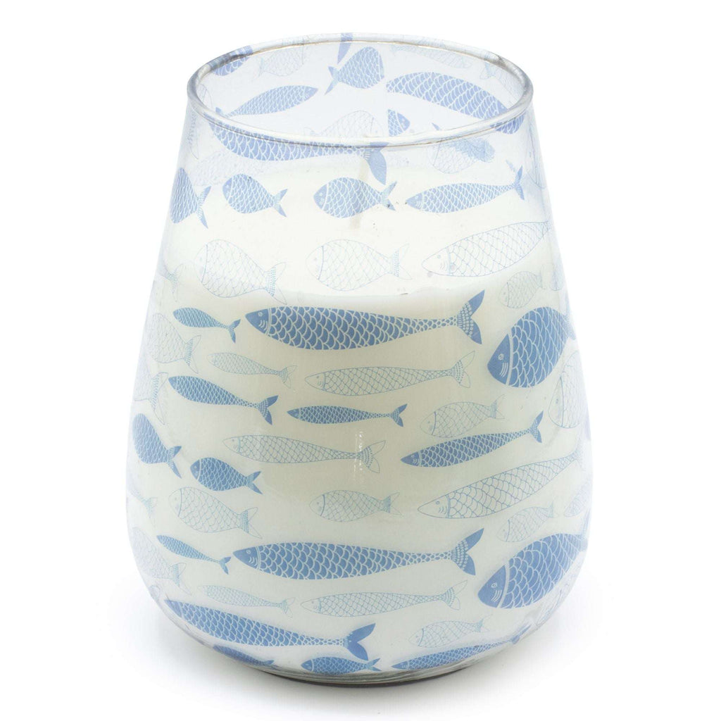 Tall Glass Jar Candles - Seabreeze features a white candle in a glass jar decorated with a pattern of light blue fish, evoking a calm and refreshing coastal vibe.