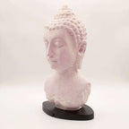 Buddha Bust Lamp Cherry Crackle - Oval stand features a crackled pink resin Buddha head sculpture on a sleek dark oval base, blending serene decor with soft ambient lighting.