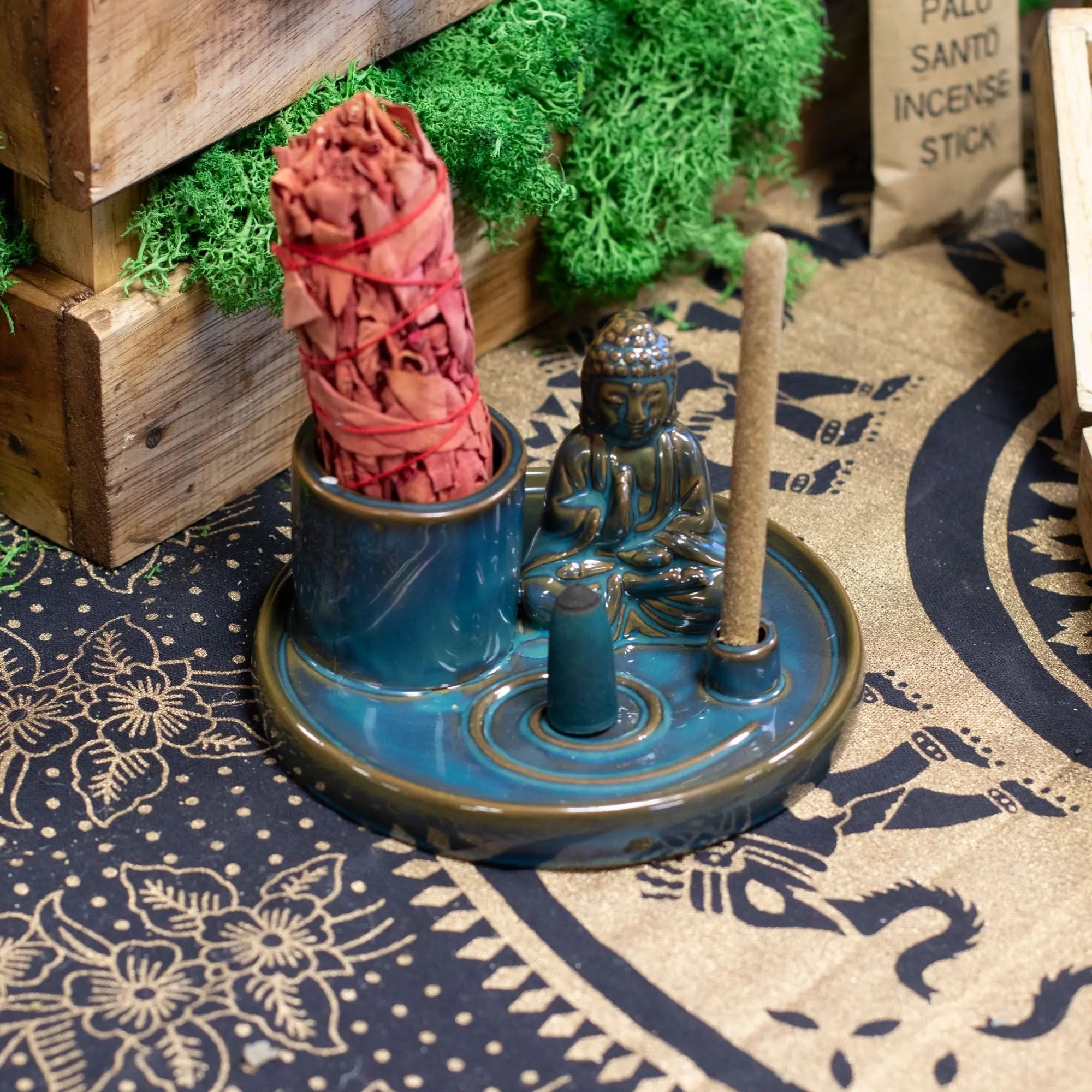 Multi Purpose Buddha Incense Plate - Ceramic Blue featuring a small Buddha figurine, holders for incense sticks and cones on a ceramic blue round tray with intricate glaze details.
