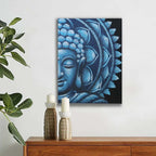 Blue Half Buddha Mandala 60x80cm wall hanging artwork featuring a serene Buddha face in shades of blue, displayed above a wooden sideboard with candles and green plant decor.