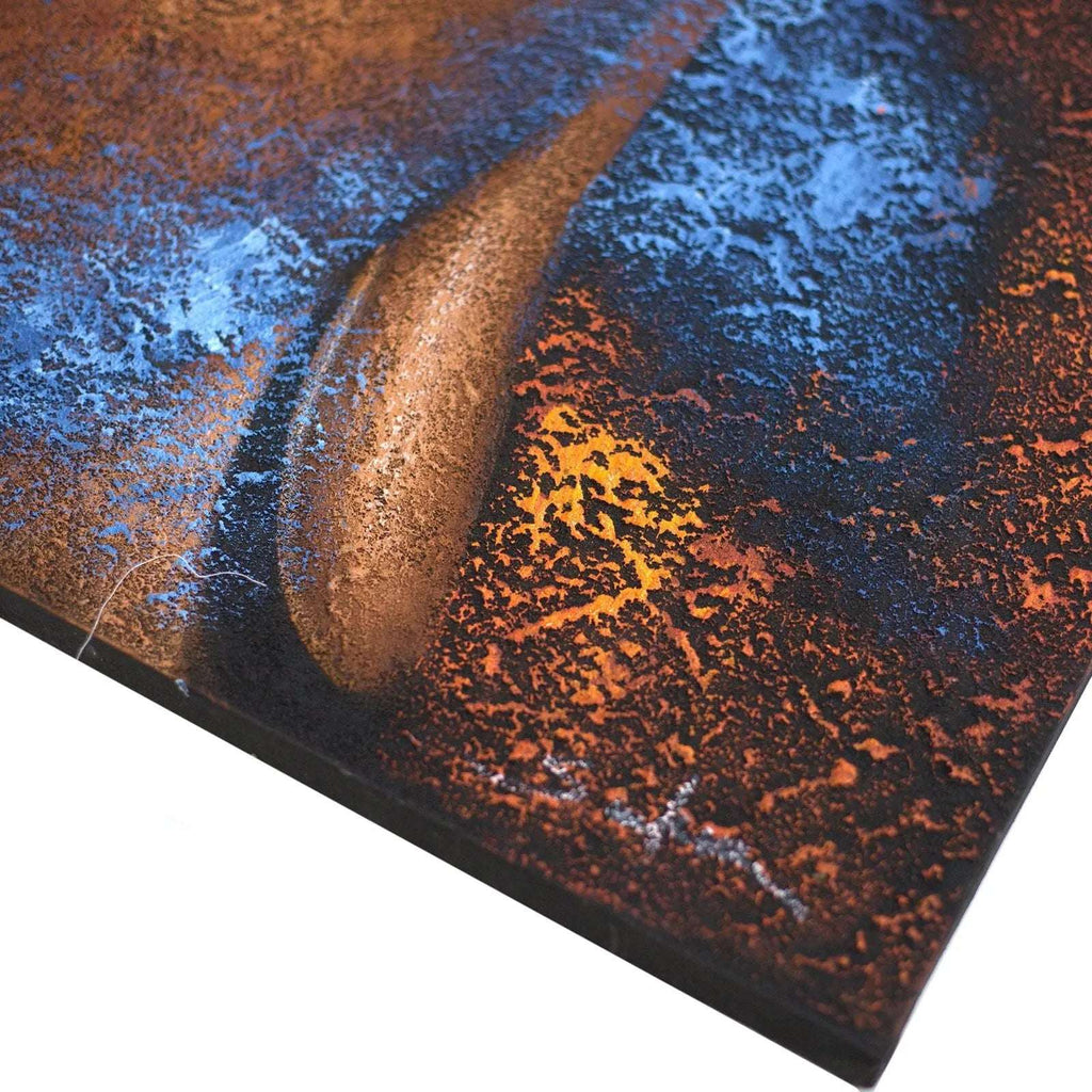 Close-up of textured metal artwork with copper and blue tones, featuring a smooth curved element as part of the Buddha Painting - Copper Face.