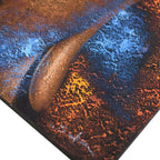 Close-up detail of Buddha Painting - Copper Face showing textured copper tones with contrasting blue and orange highlights on a Buddha face artwork.