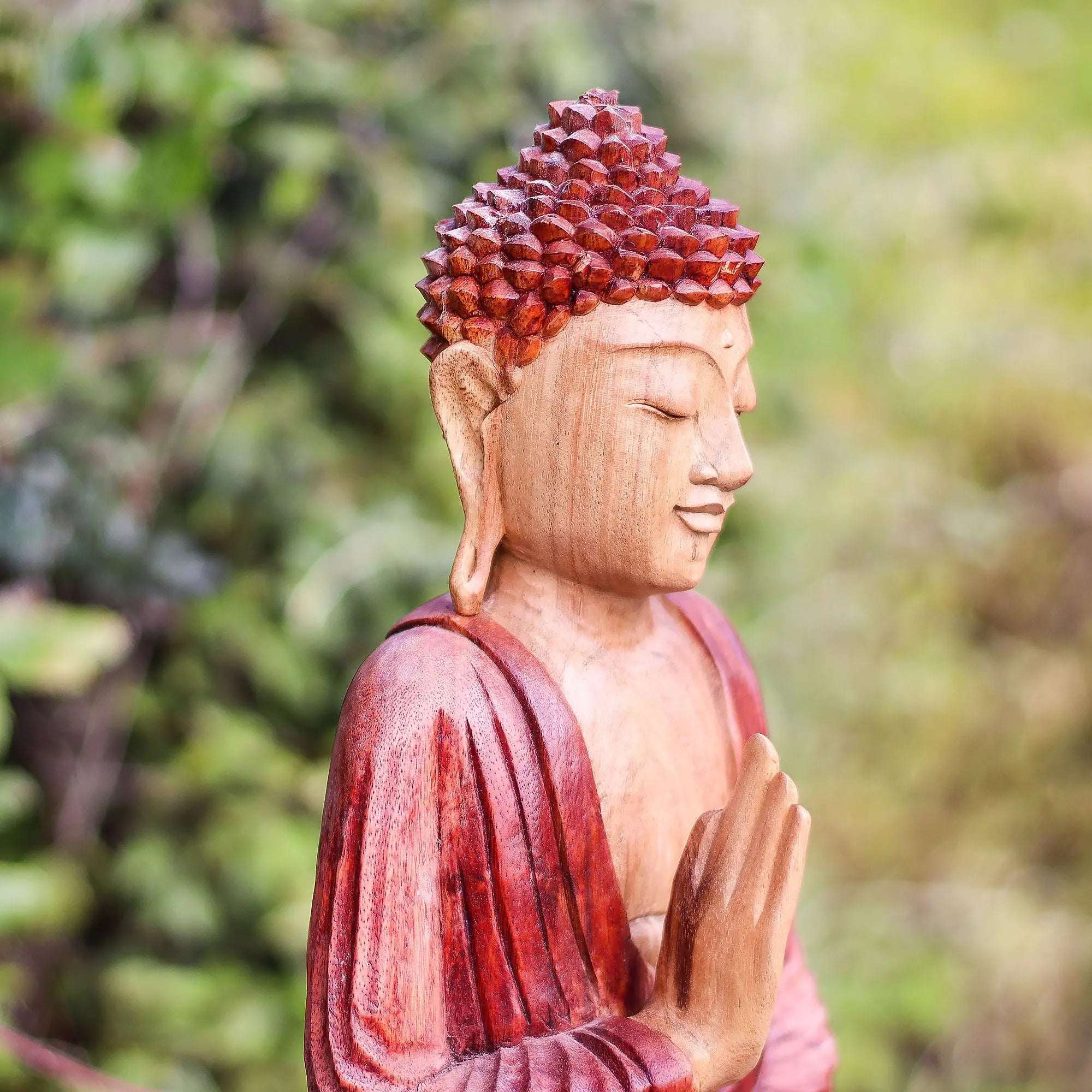 Hand Carved Buddha Statue - 30cm Teaching Transmission featuring detailed carving in warm wood tones with a peaceful expression, set against a natural blurred green background.