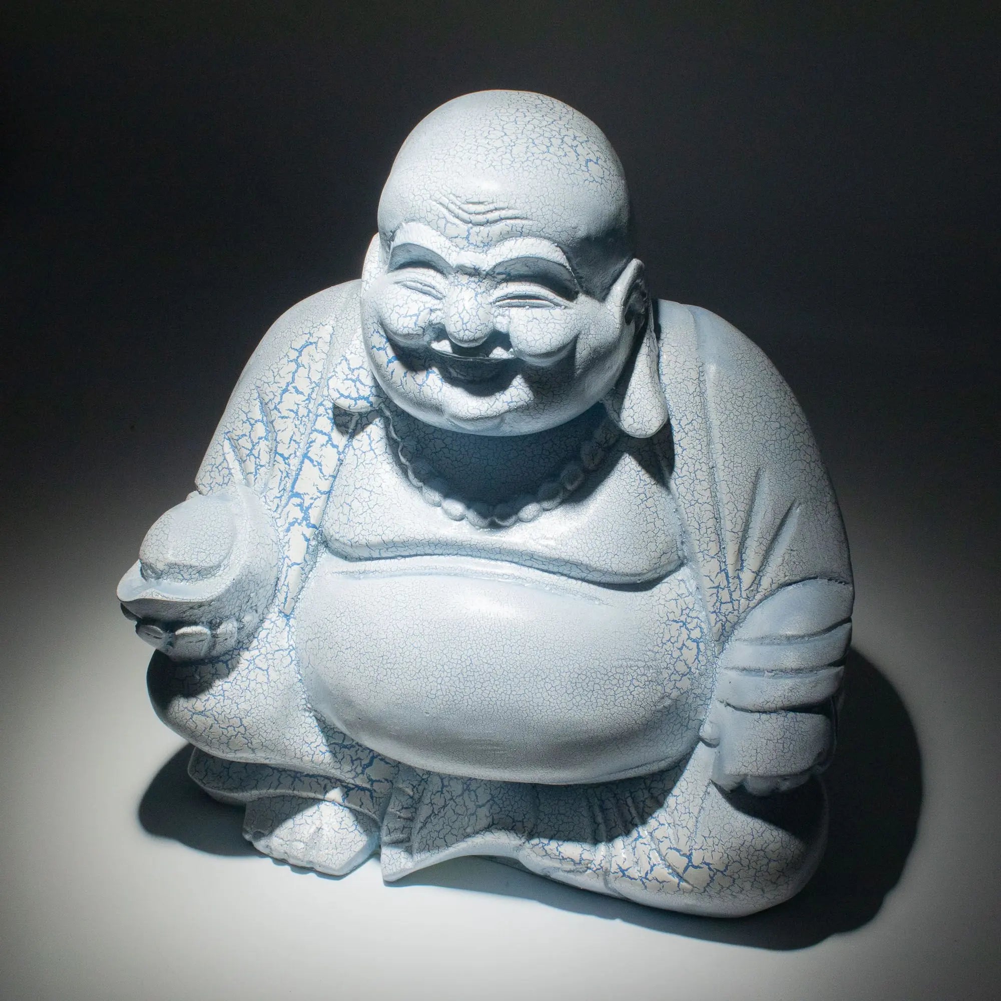 Laughing Buddha Lamp Sky Blue - Round Stand featuring a joyful Buddha figure with a crackled sky blue finish sitting on a round base, designed as a decorative Buddha glow lamp.