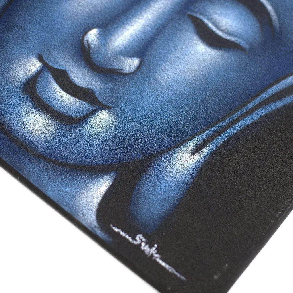 Close-up of a serene face in a Buddha Painting - Blue Sand Finish with textured blue tones and smooth shading, highlighting calm expression and peaceful features.