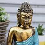 Teal & Gold Buddha - Large statue featuring a serene expression with hand-carved details, gold finish on the face and torso, and a teal robe, ideal for Buddha decor.