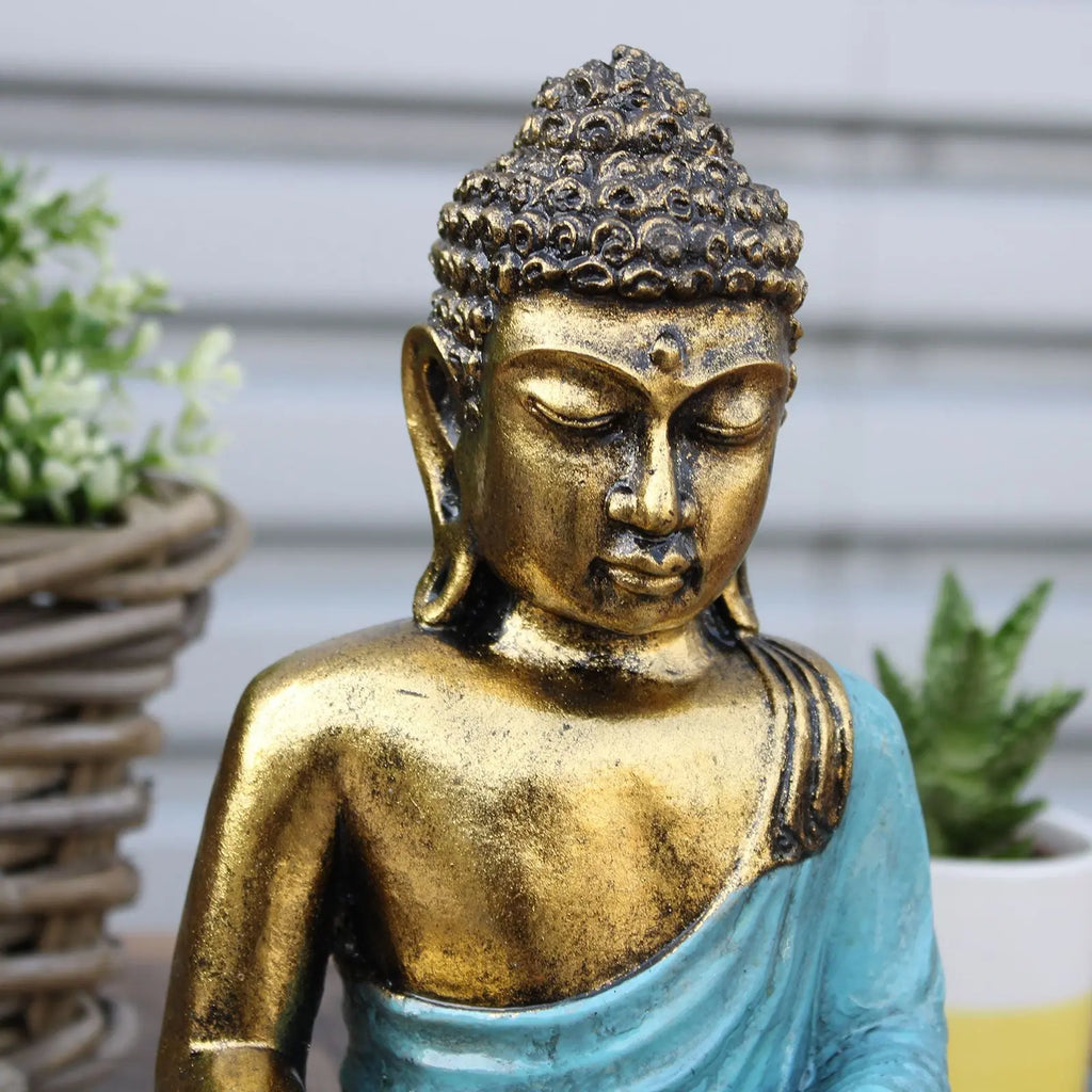 Teal & Gold Buddha - Large statue featuring a serene Buddha figure with a gold finish and teal robe, ideal for peaceful decor and meditation spaces.