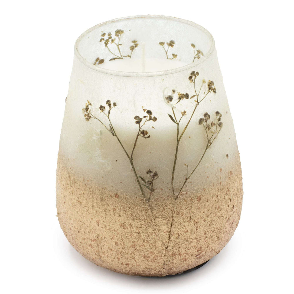 Tall Glass Jar Candles - Wildlight Woods featuring a rustic design with delicate dried floral accents embedded in a translucent frosted glass jar.