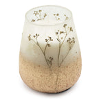 Tall Glass Jar Candles - Wildlight Woods featuring a rustic design with delicate dried floral accents embedded in a translucent frosted glass jar.