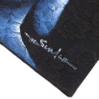 Close-up of the corner of the Buddha Painting - Three Heads Black, showing intricate floral lace textures and a subtle artist signature on the dark, serene background.