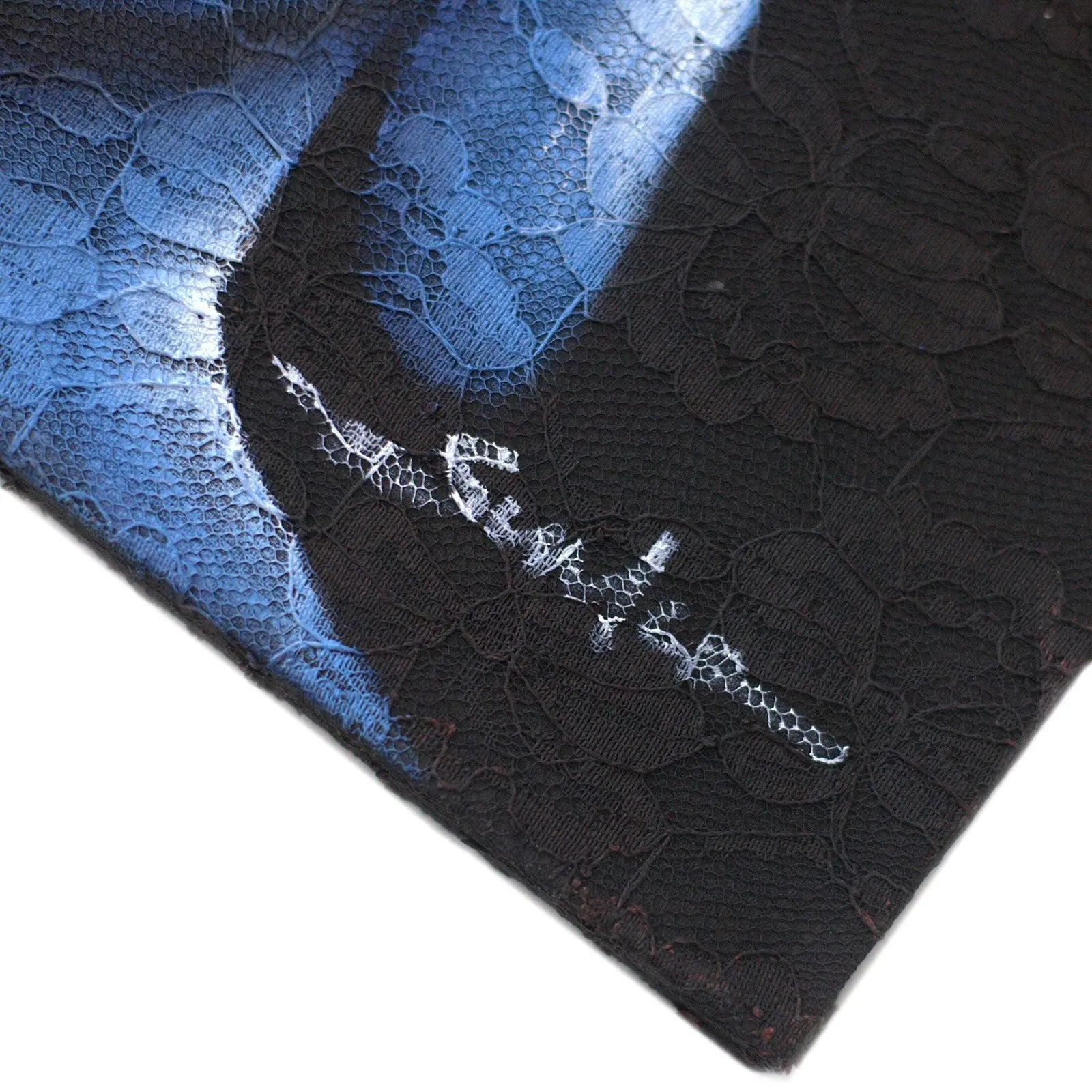 Close-up of a dark Buddha Painting - Three Heads Black featuring delicate lace texture and an artist's signature in white on the bottom corner.