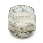 Medium Glass Jar Candles - Drawn by Flame featuring delicate black and white illustrations of hummingbirds and floral elements on a frosted glass container.