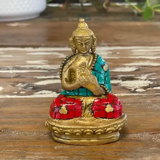 Brass Buddha Figure - Hands Up - 7.5 cm seated on a detailed base, adorned with colorful red and turquoise mosaic inlays, showcasing traditional craftsmanship and Buddha decor charm.