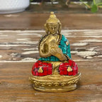 Brass Buddha Figure - Hands Up - 7.5 cm seated on an ornate base, adorned with colorful red and turquoise mosaic details enhancing the traditional design.
