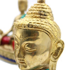 Close-up view of the detailed face of a Brass Buddha Figure - Lrg Head - 11.5 cm with smooth polished surface and intricate hair texture, showcasing Buddha decor craftsmanship.