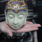 Handheld Buddha Oil Burner - Ivory & Mint with a serene face design and a textured glaze combining soft ivory and mint colors, ideal for calming home decor.