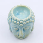 Buddha Oil Burner - Blue featuring a serene Buddha head design with a smooth, light blue finish, perfect for use as a stylish Buddha decor and oil burner.