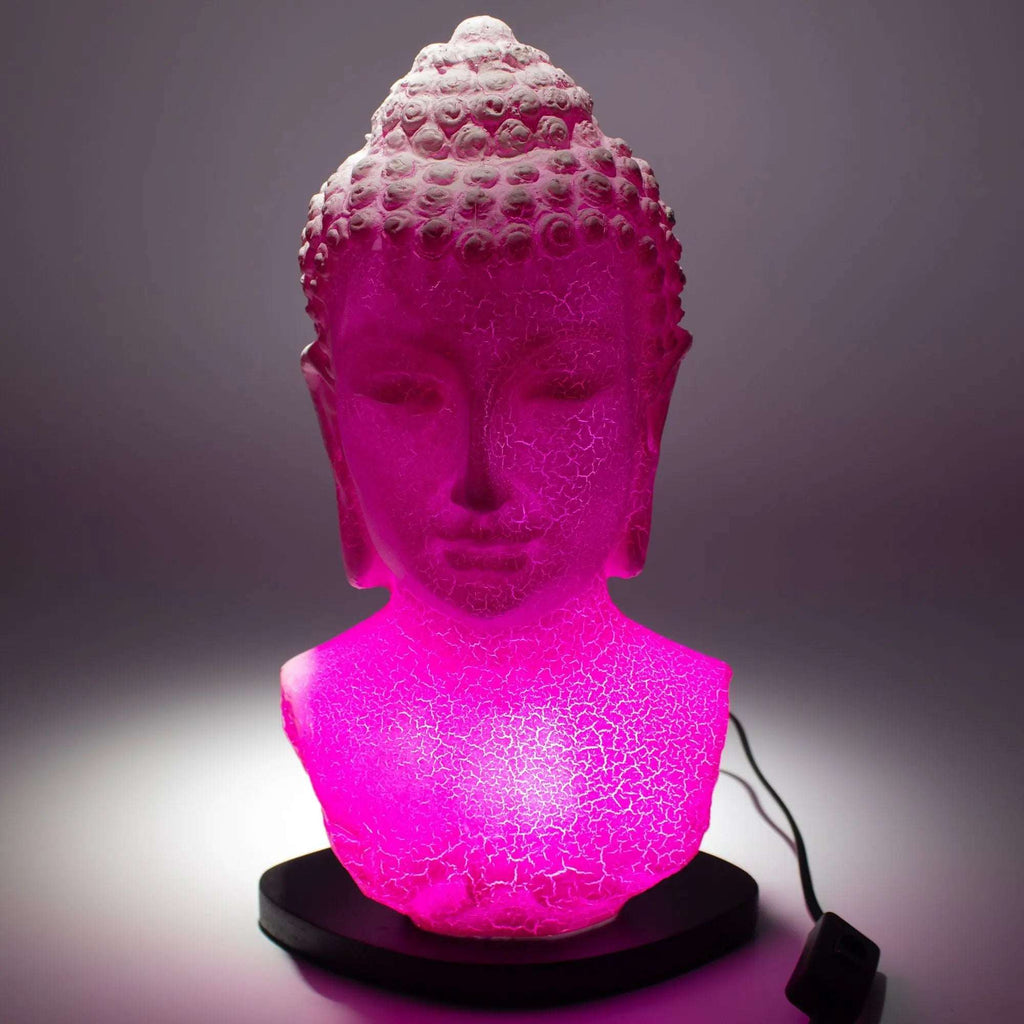 Buddha Bust Lamp Cherry Crackle - Oval stand glowing with vibrant pink light, featuring a textured crackle finish on the Buddha head sculpture on a sleek black oval base.