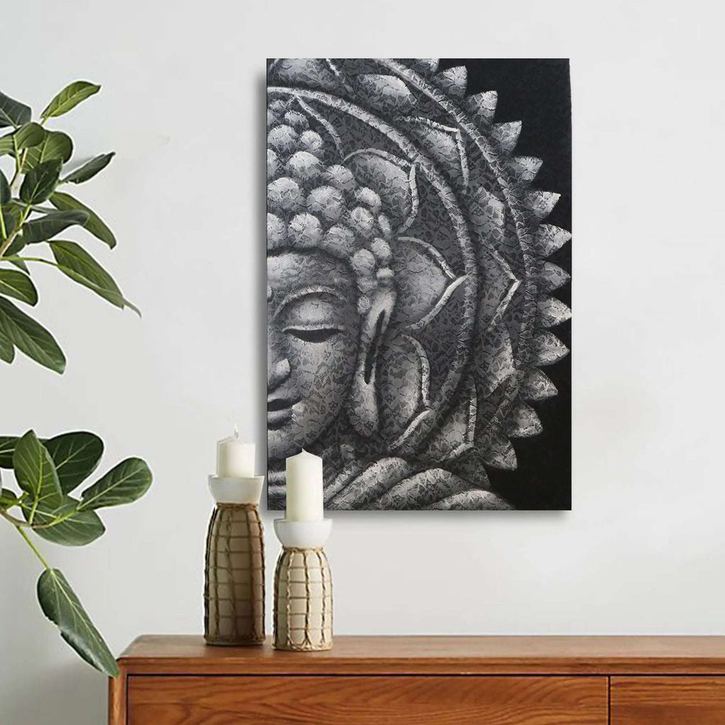 Grey Half Buddha Mandala 60x80cm featuring a serene Buddha face with intricate mandala patterns in shades of grey, displayed above a wooden surface with decorative candles and greenery.