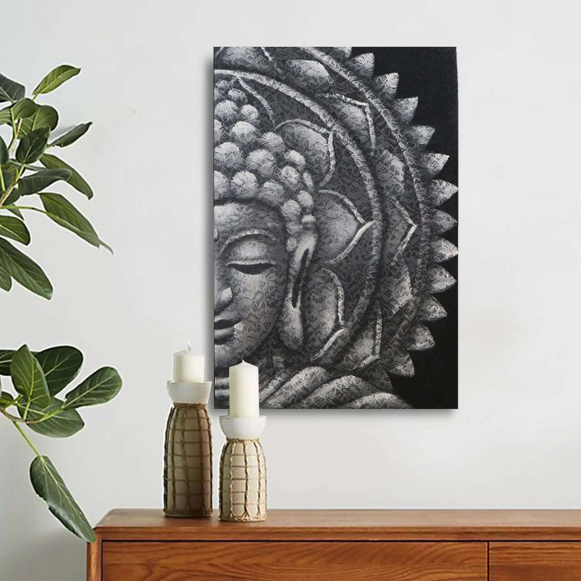 Grey Half Buddha Mandala 60x80cm featuring a serene Buddha face with intricate mandala patterns in shades of grey, displayed above a wooden surface with decorative candles and greenery.