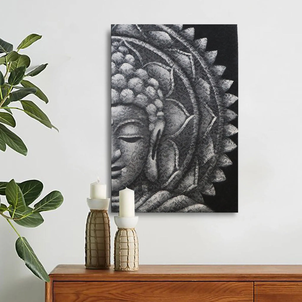 Grey Half Buddha Mandala 60x80cm wall art featuring a serene Buddha face with intricate mandala patterns in shades of grey, displayed above a wooden console with decorative candles and green plant.