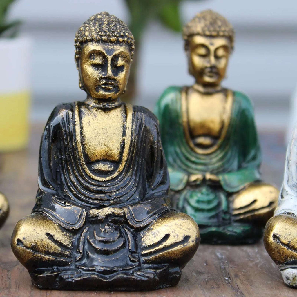 Gold Mini Buddha (Assorted Colours) featuring a hand-carved Buddha statue in black and gold finish with serene facial expression and detailed robes, ideal for Buddha decor.