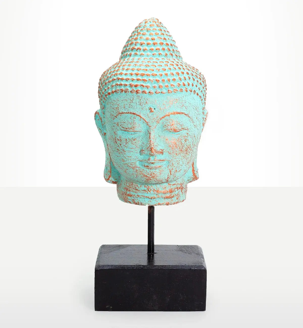 Stillness Buddha Head on Stand - Green Copper featuring a serene hand-carved Buddha head with oxidized green copper finish mounted on a minimalist black stand, ideal Buddha decor.