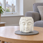 Buddha Oil Burner - White on a stone mat in a British sitting room