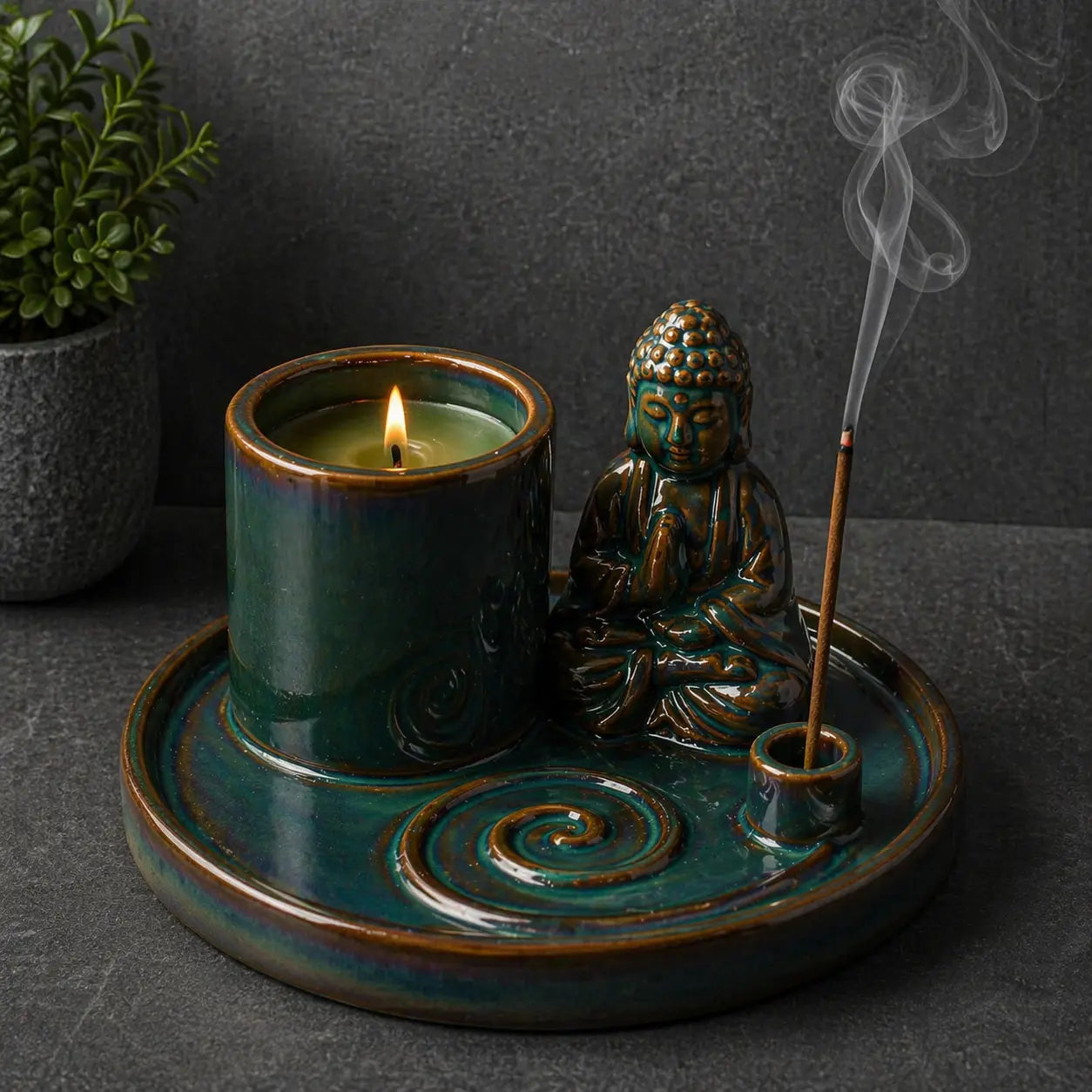 Multi Purpose Buddha Incense Plate - Ceramic Blue featuring a meditative Buddha figure, a lit candle holder, and a burning incense stick with smoke rising against a dark textured background.