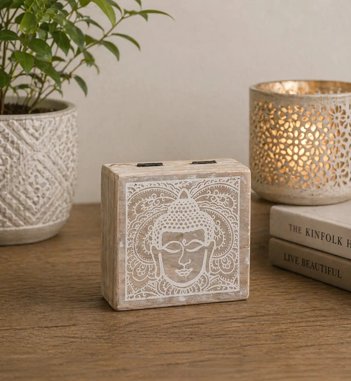 Small Square Box 10x10x4.2cm - Buddha Face Whitewash featuring a whitewashed carved Buddha face design, styled with a decorative planter and candle holder on a wooden surface.