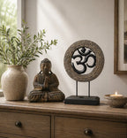 Buddha Feng Shui Set - Om - Grey & Black featuring a hand-carved Buddha statue and an Om symbol on a stand, displayed with natural decor on a wooden surface.