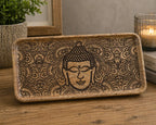 Long Tray 30x15x2.5cm - Buddha Face Black Engraved features a hand-engraved Buddha face design with intricate patterns on a wooden tray, ideal for Buddha decor and incense plates.