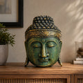 Home Decoration Buddha Head - 25cm - Green Shine Finish displayed on a wooden surface, featuring detailed ornamental patterns and a serene expression, ideal for Buddha decor.