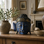 Home Decoration Buddha Head - 25cm - Blue Shine Finish displayed on a wooden table with a rustic ceramic vase and elegant living room décor in the background.