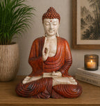 Hand Carved Buddha Statue - 40cm Teaching Transmission in serene meditation pose with detailed robes, displayed on a wooden surface beside a plant and candle for peaceful Buddha decor.